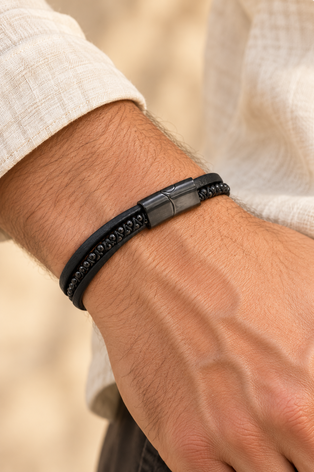Men’s Black PU Leather & Stainless-Steel Bracelet 22cm worn on a model's wrist