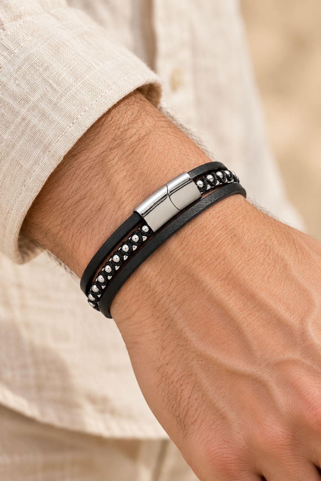 Men’s Black PU Leather & Stainless-Steel Bracelet 22cm worn on a model's wrist