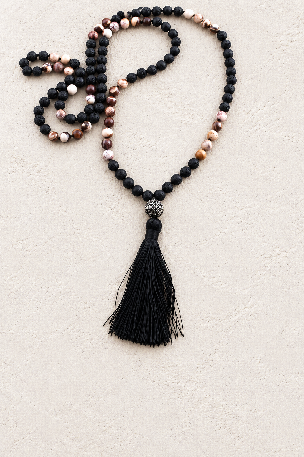 Midnight Mala Necklace on warm ivory plaster background