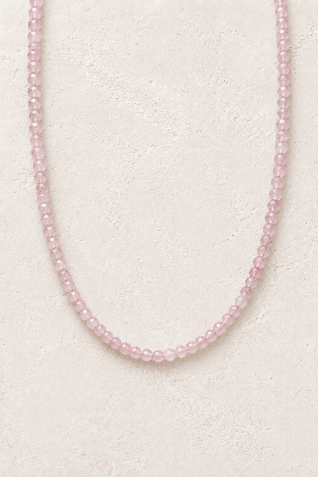 Mireya Rose Quartz faceted gemstone bead necklace on a light neutral background