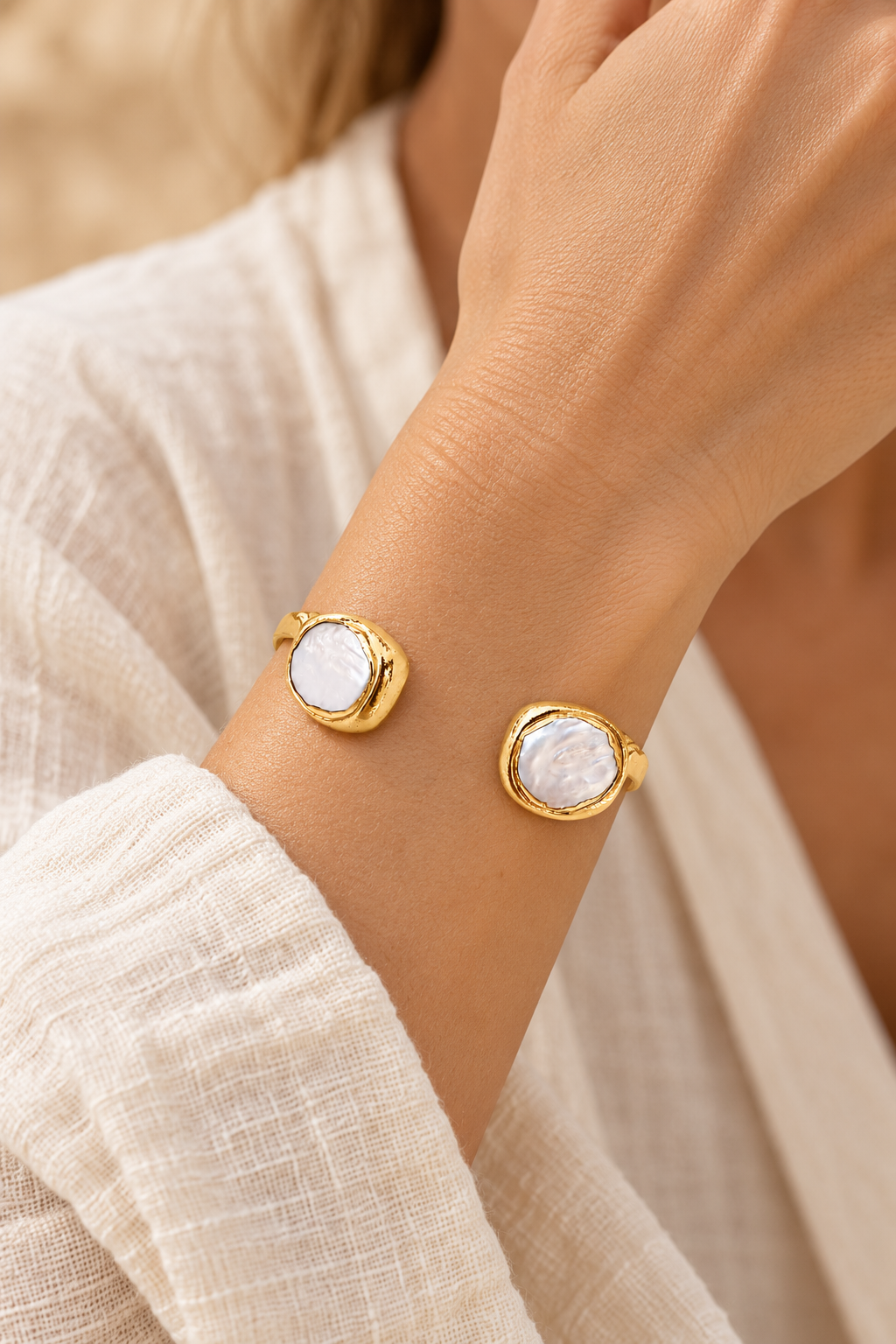 Nerina Circle Fresh Water Pearl Cuff Bracelet worn on a model's wrist