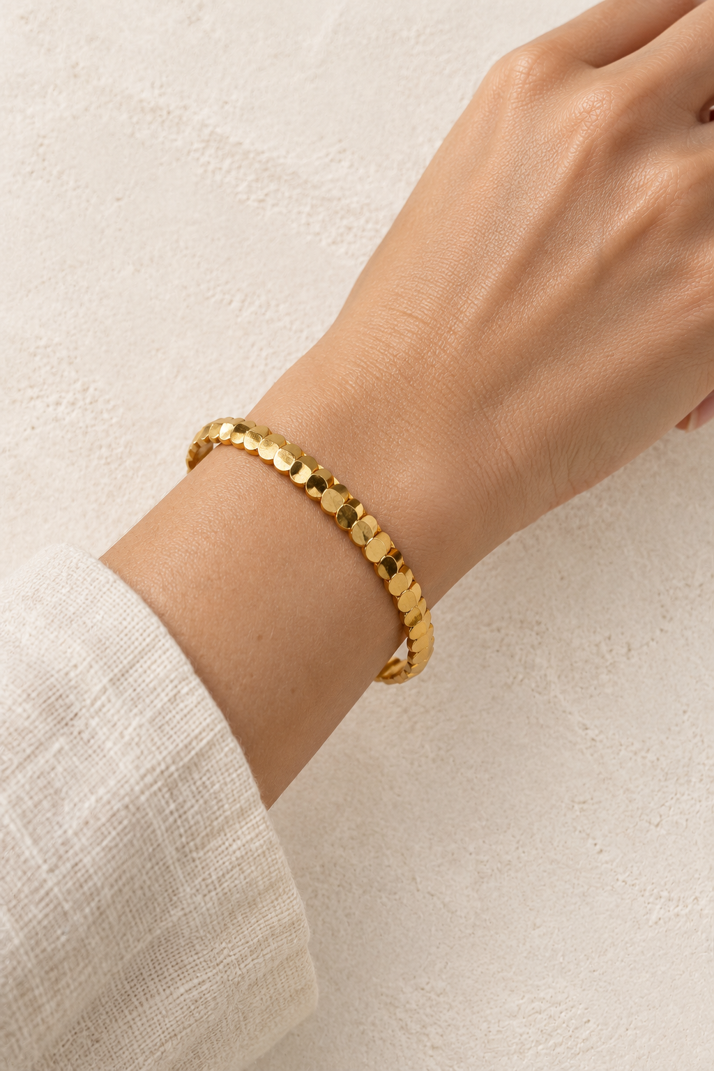 
                  
                    Model wearing Paloma Gold Petal Bangle
                  
                