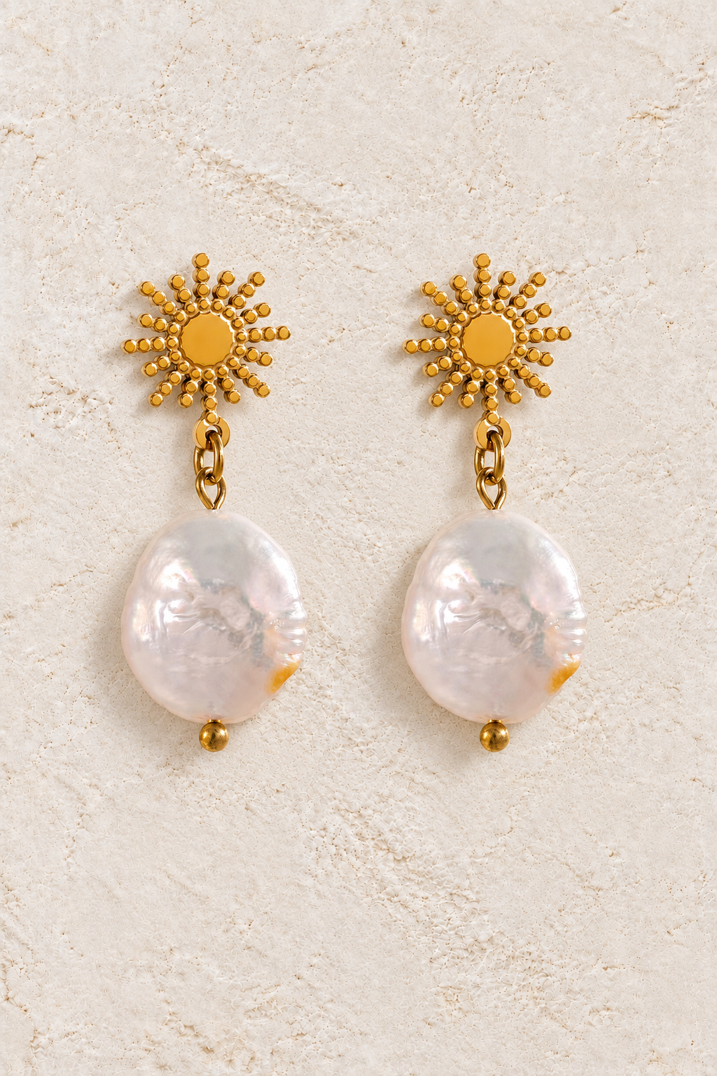 Gold Beaded Sunburst Coin Pearl Drop Earrings on cream plaster