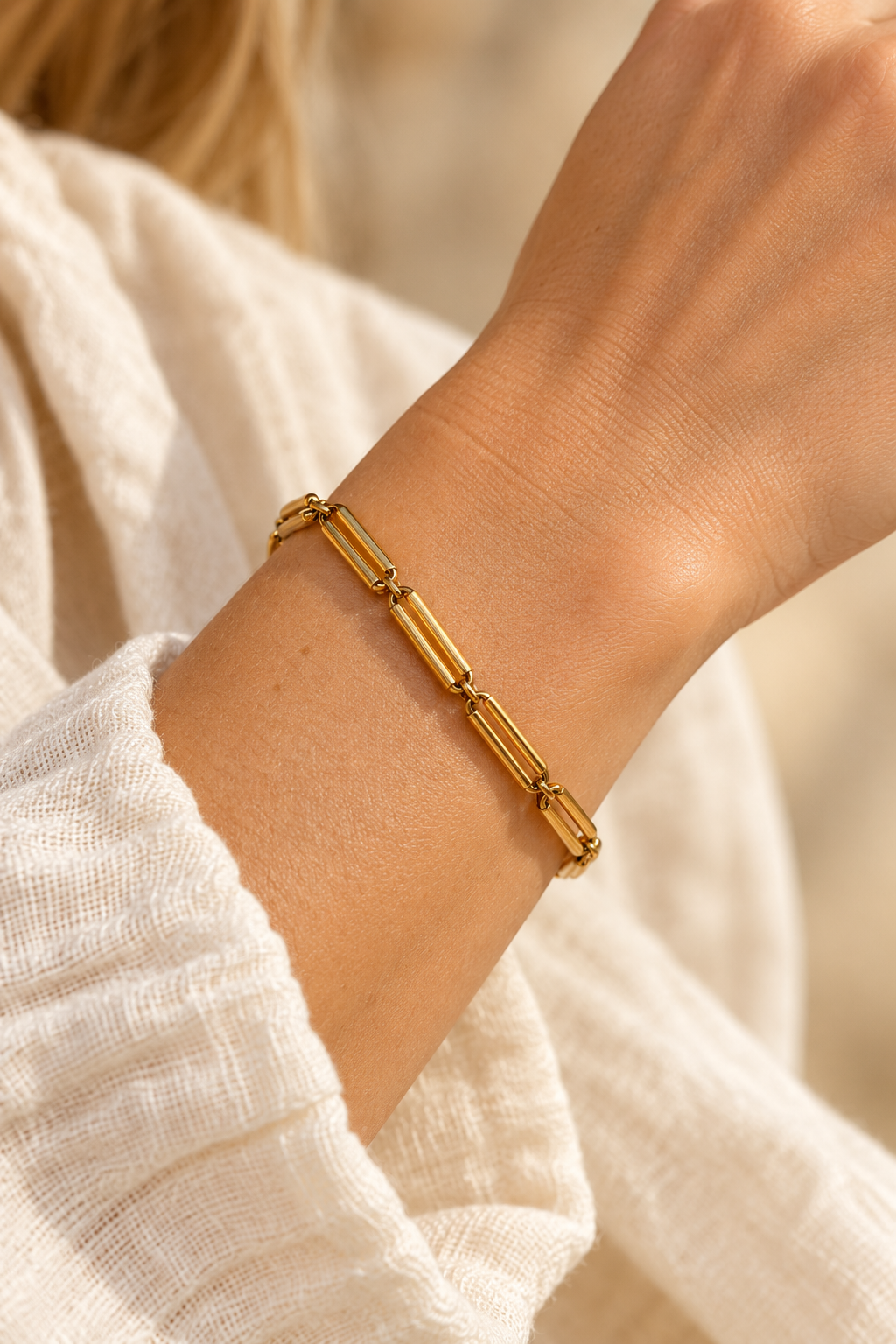 
                  
                    Renata Gold Sculpted Link Bracelet worn on a model's wrist
                  
                