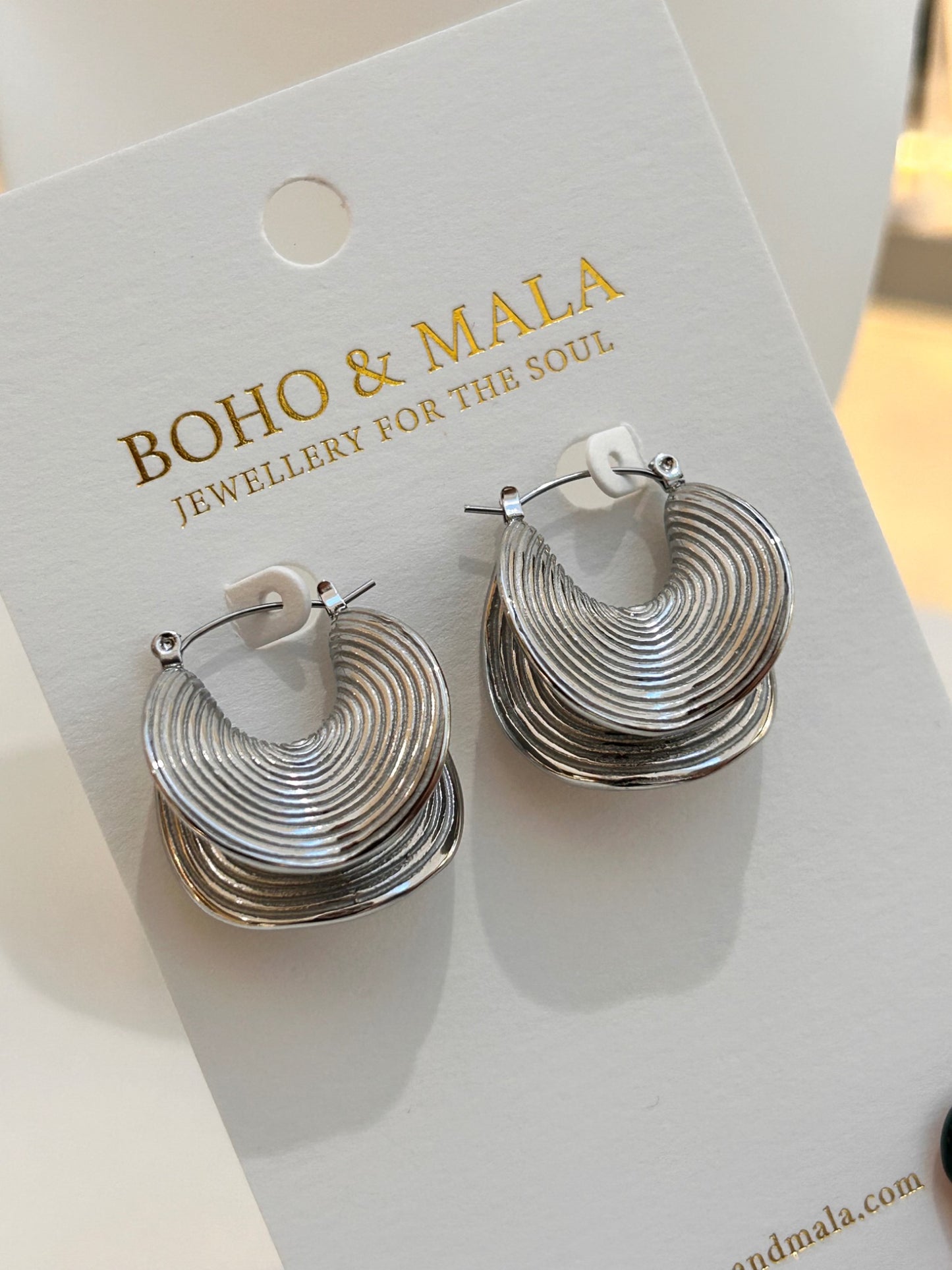 
                  
                    Rhea Ripple Silver Hoops on Boho & Mala display card
                  
                