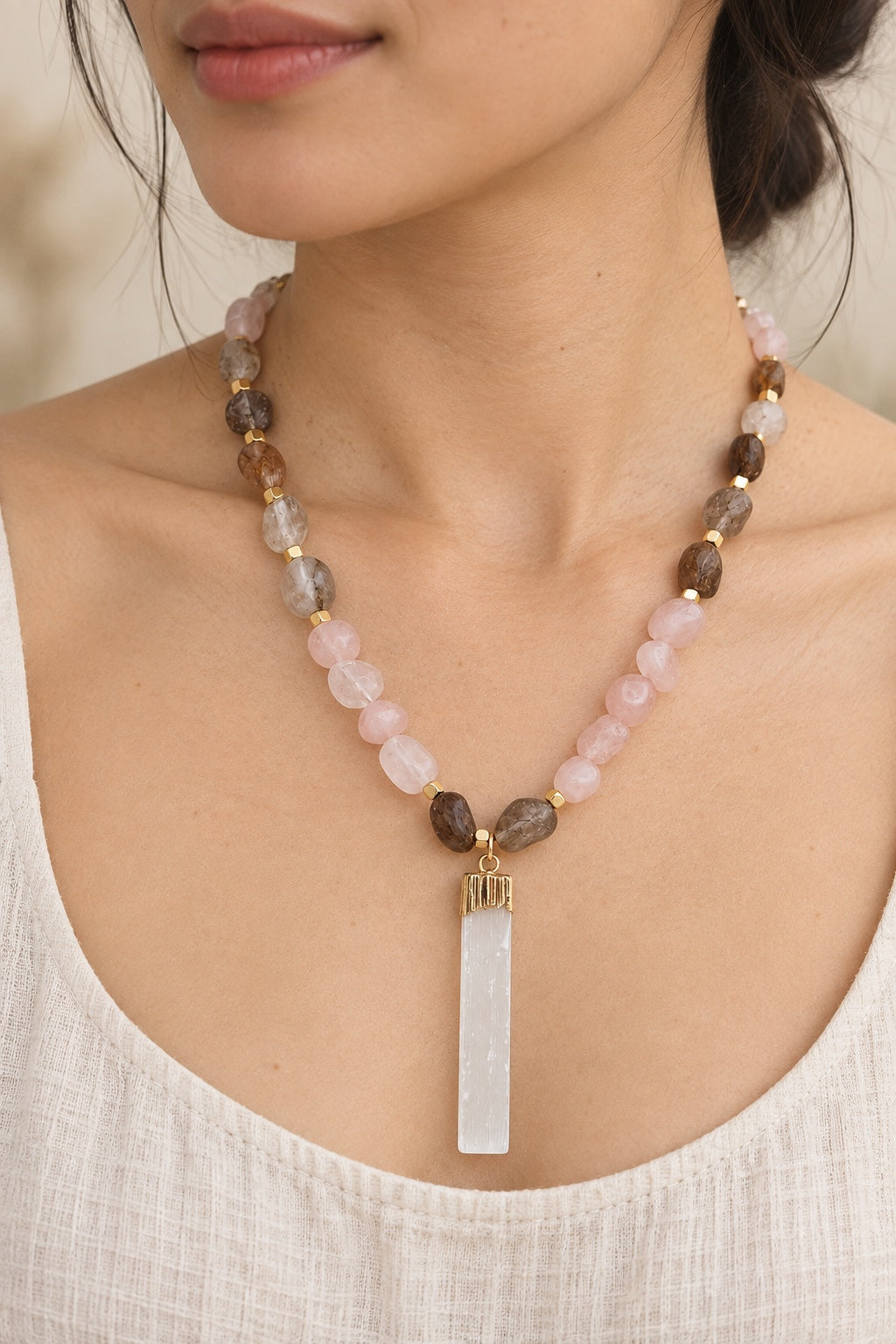Boho model wearing the Rosamira Rose Quartz and selenite pendant necklace