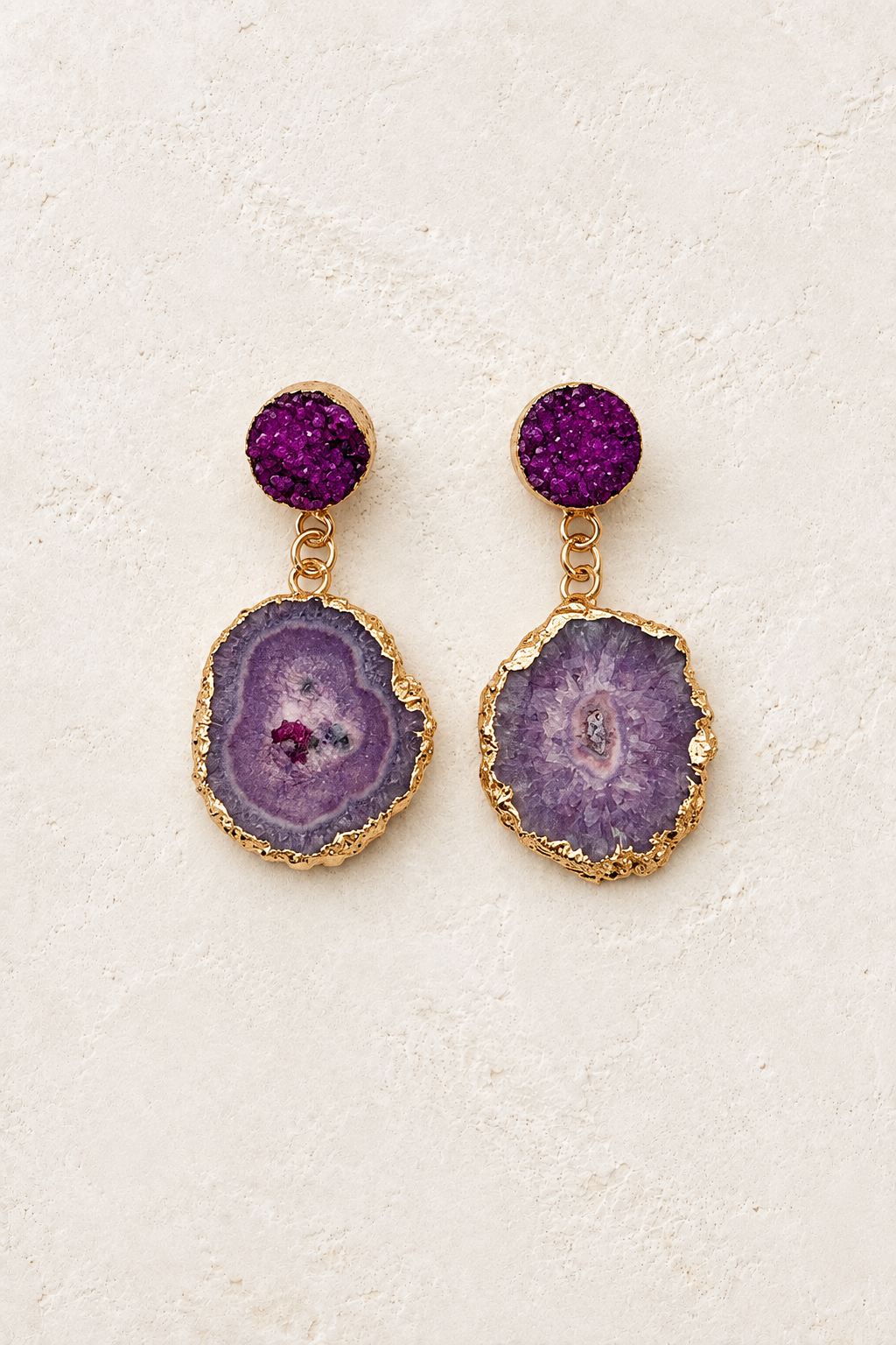 
                  
                    Sahira Amethyst Druzy Drop Earrings on cream textured background
                  
                