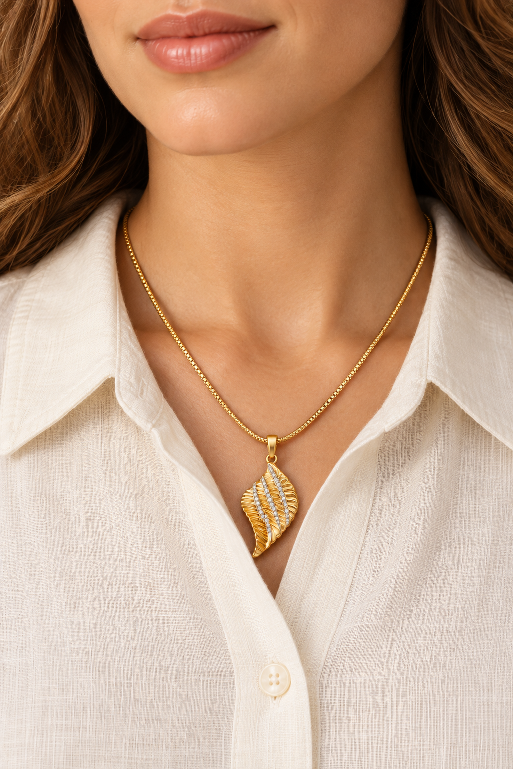 Seraphina Gold Angel Wing Necklace worn on a model