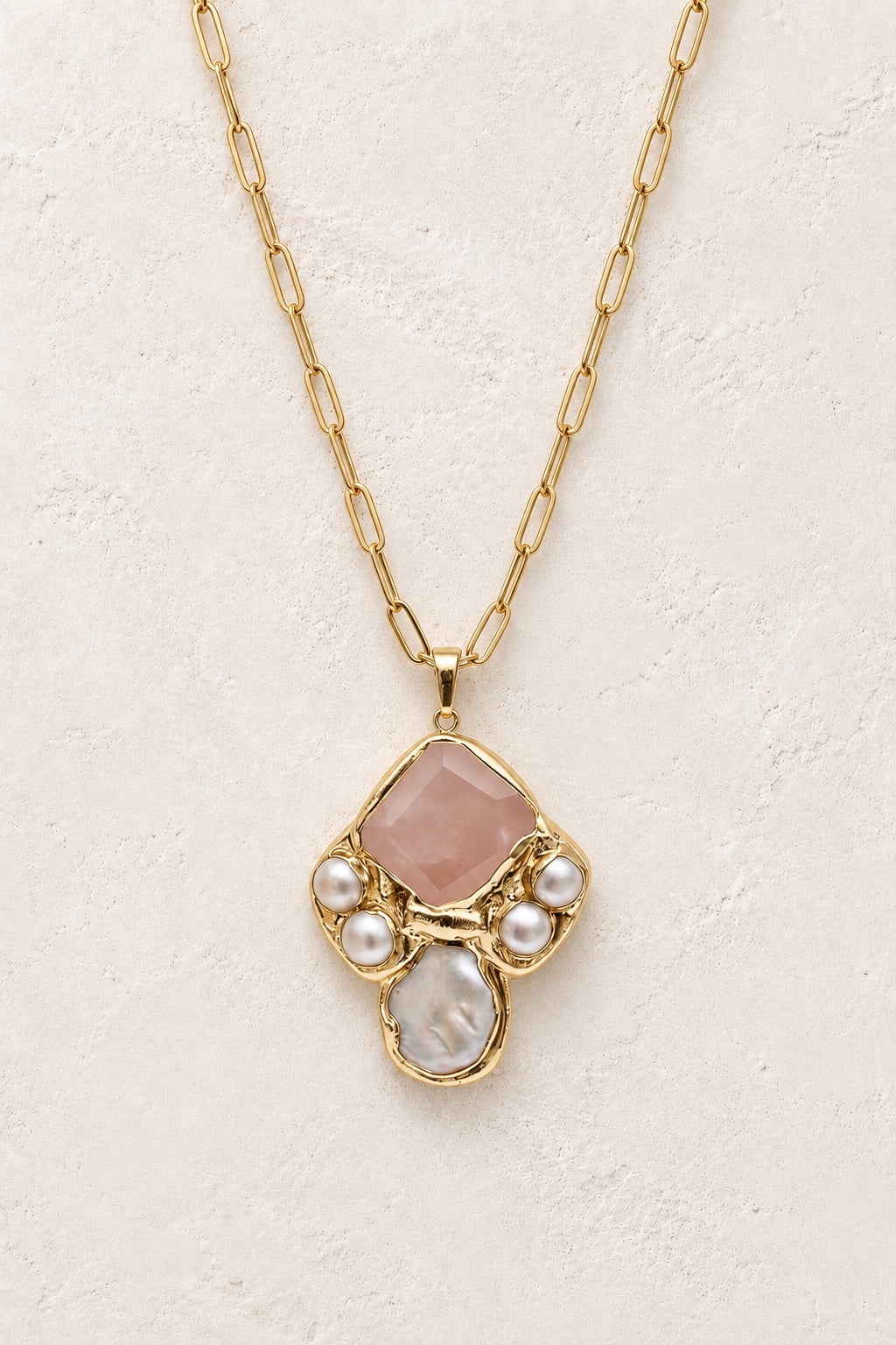 Seravelle Rose Quartz statement necklace with pearl accents on a neutral background