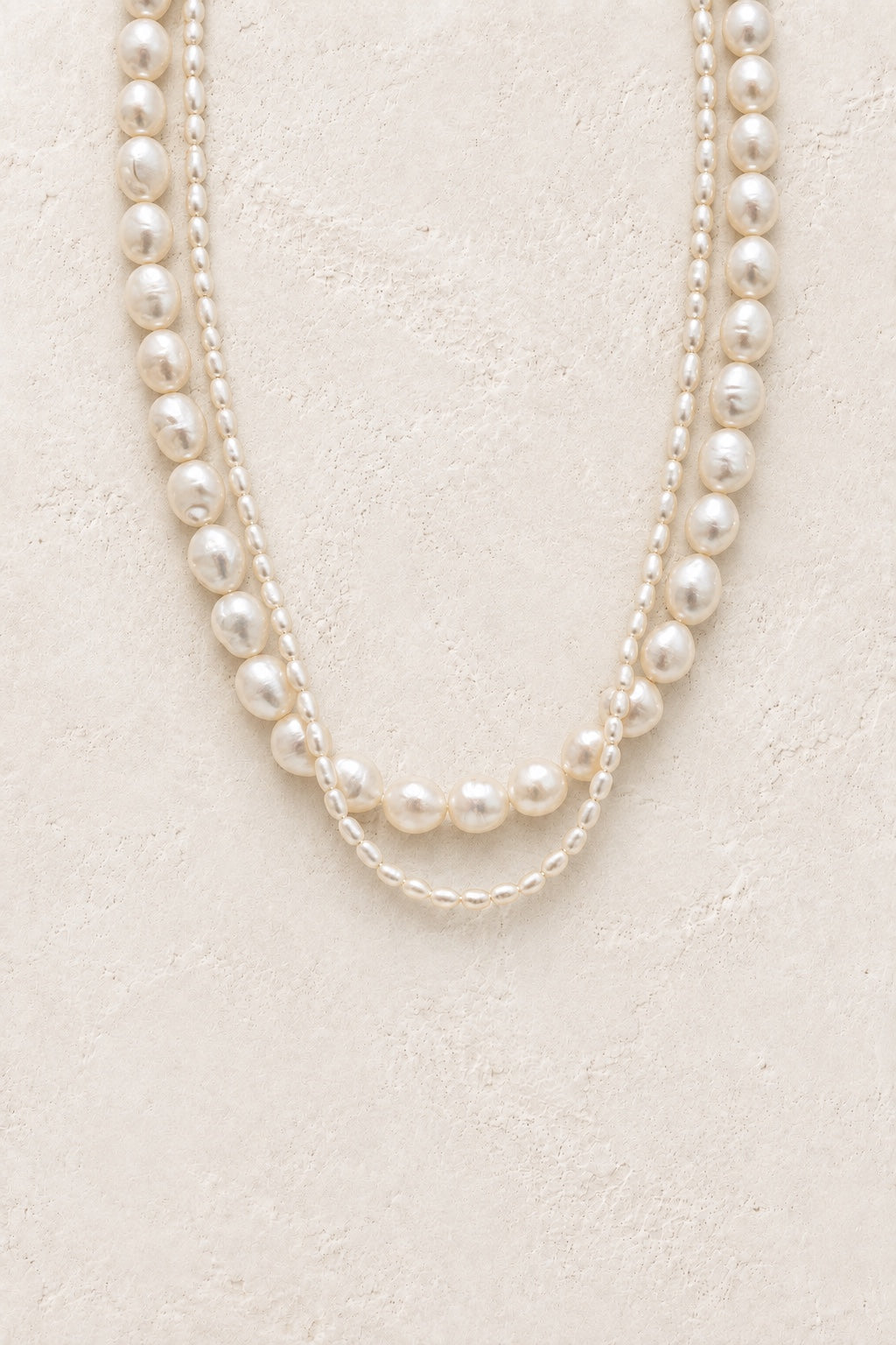 Serenelle double-strand freshwater pearl necklace on a neutral background