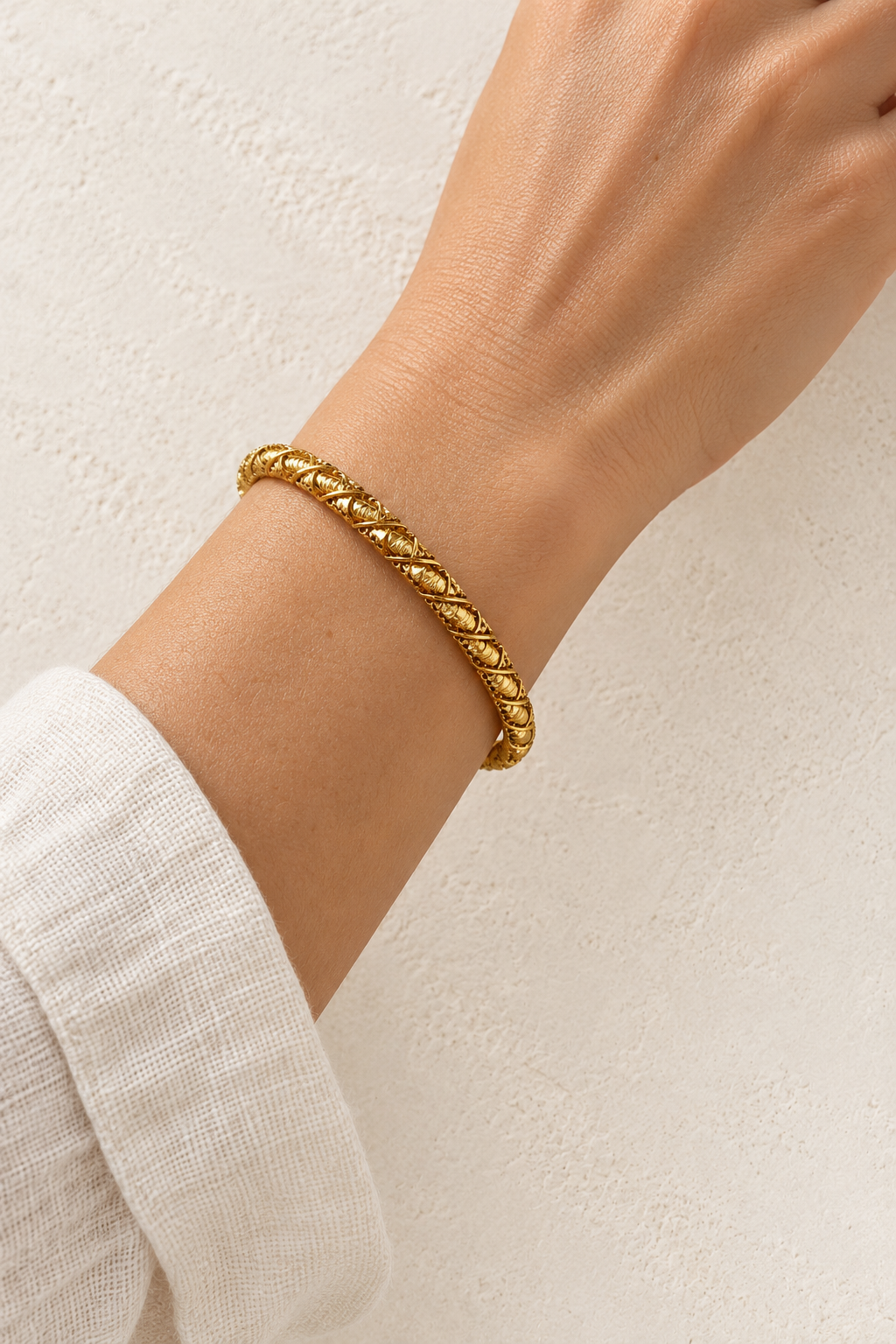 
                  
                    Model wearing Sienna Gold Rope Bangle
                  
                