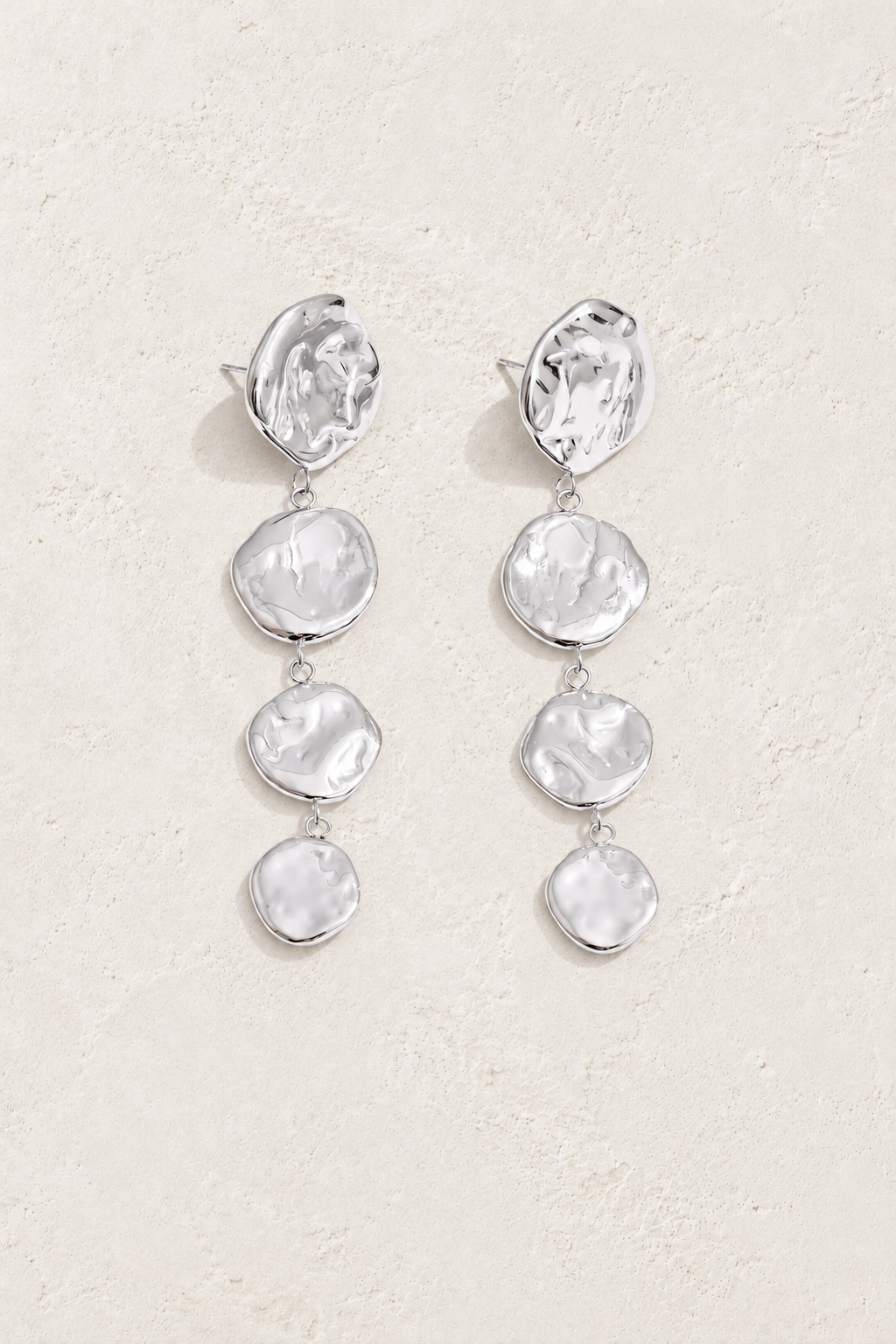 Silver Hammered Four Disc Drop Earrings — original cream plaster hero