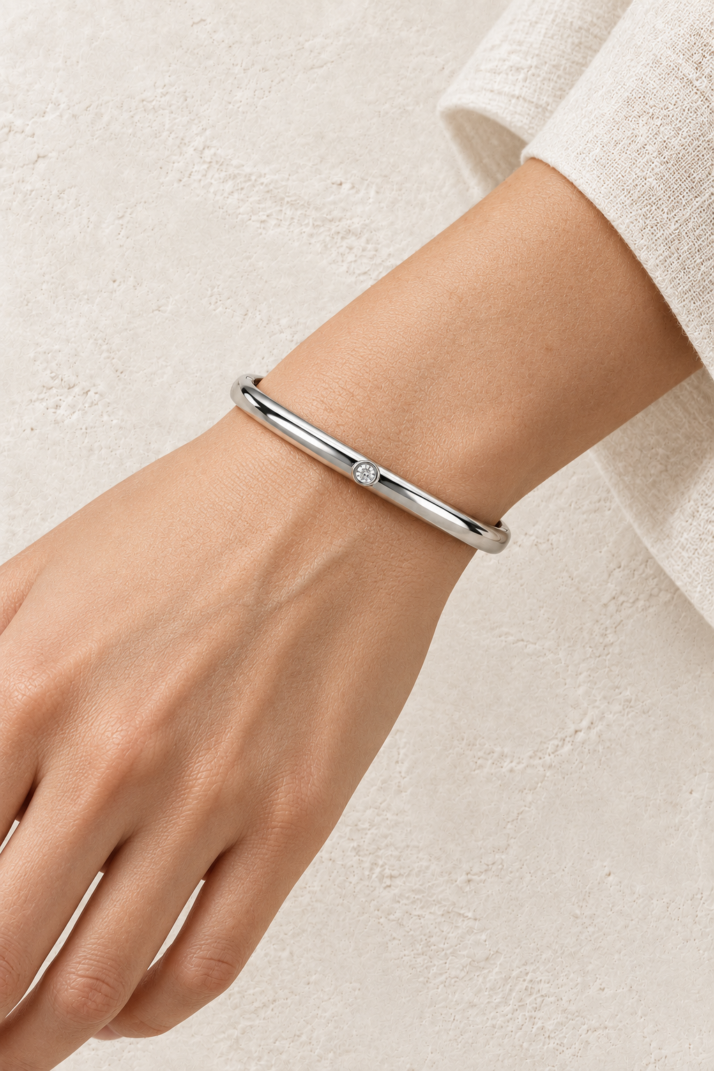 
                  
                    Model wearing Sola Silver Solitaire Bangle
                  
                