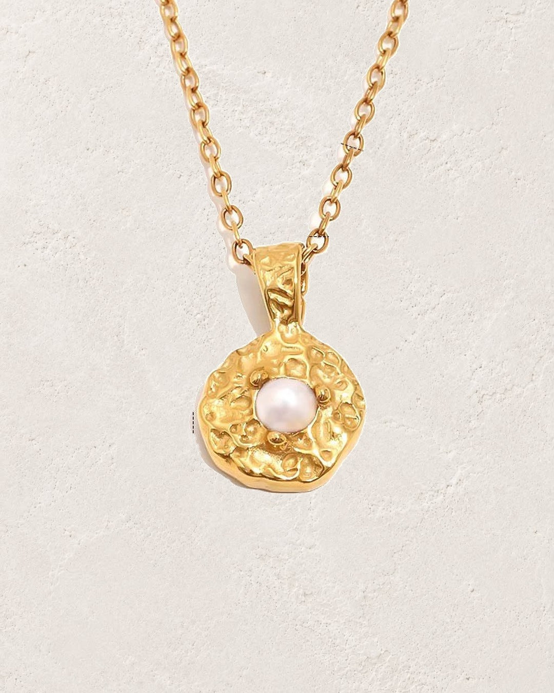 Solara June pearl birthstone necklace on cream plaster background