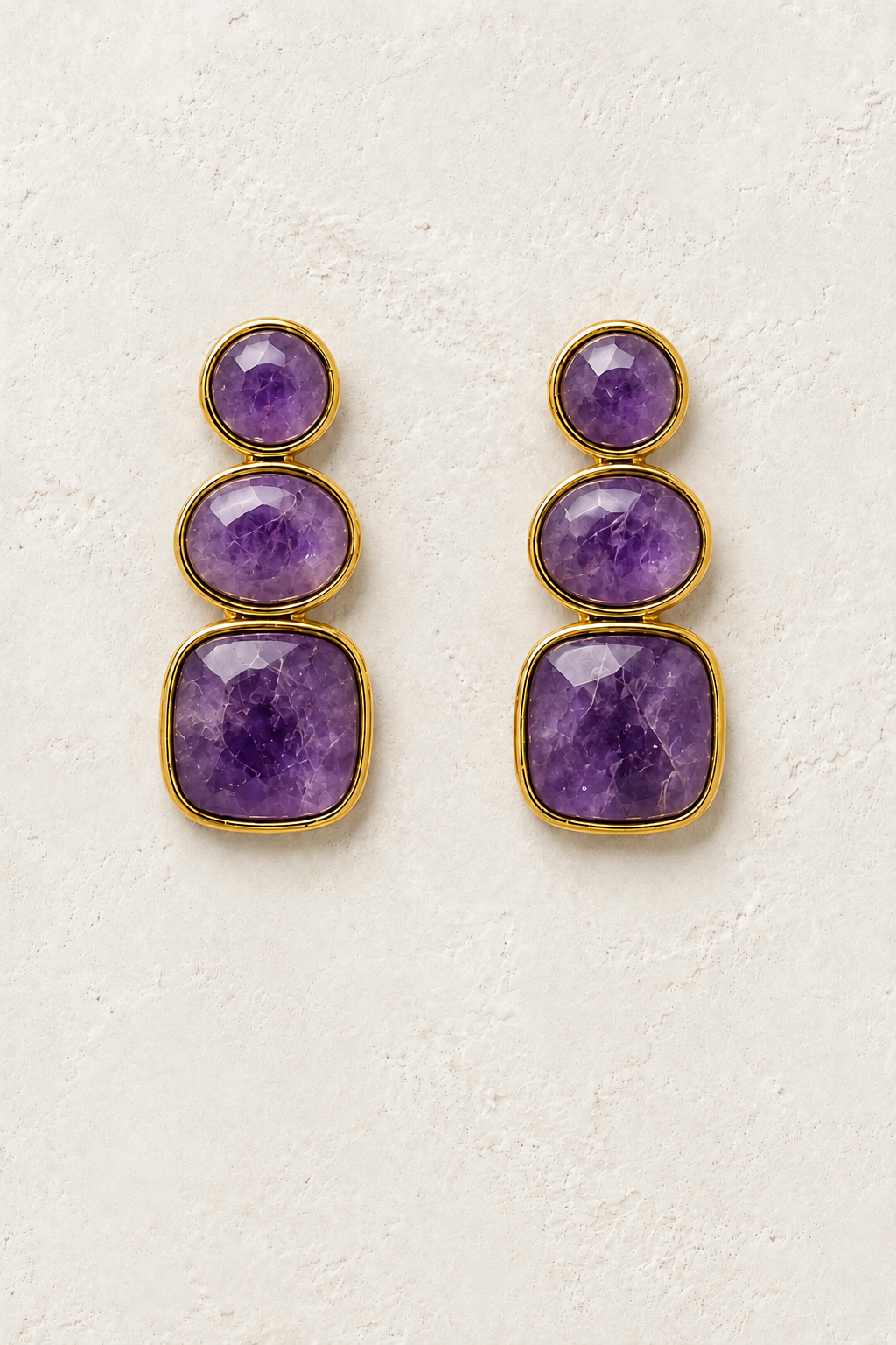 Solenne Amethyst genuine gemstone stud drop earrings on cream textured background