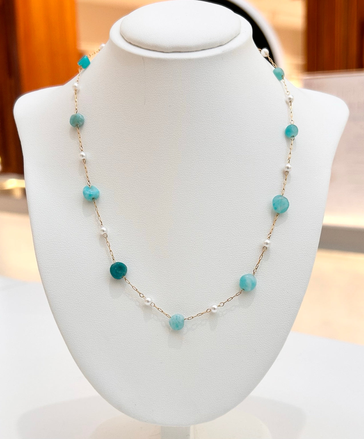 
                  
                    Solmara Amazonite tarnish-free gold-plated necklace displayed on a jewellery bust
                  
                