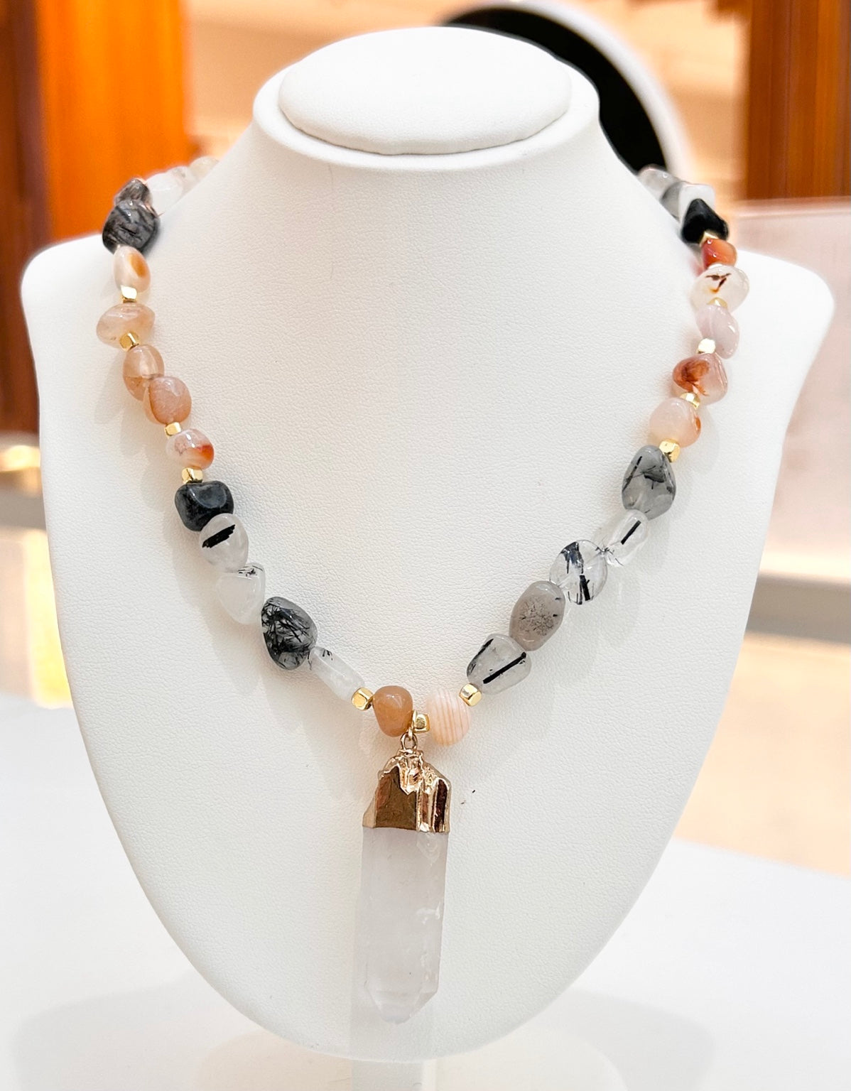 
                  
                    Sorelia mixed gemstone and selenite stick necklace displayed on a jewellery bust
                  
                
