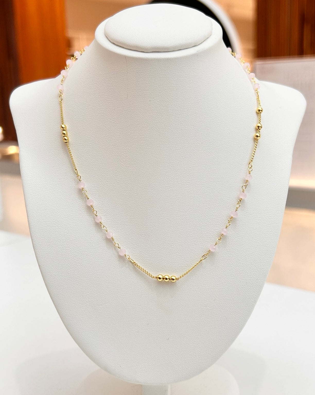 
                  
                    Sorella Rose Quartz tarnish-free necklace displayed on a jewellery bust
                  
                