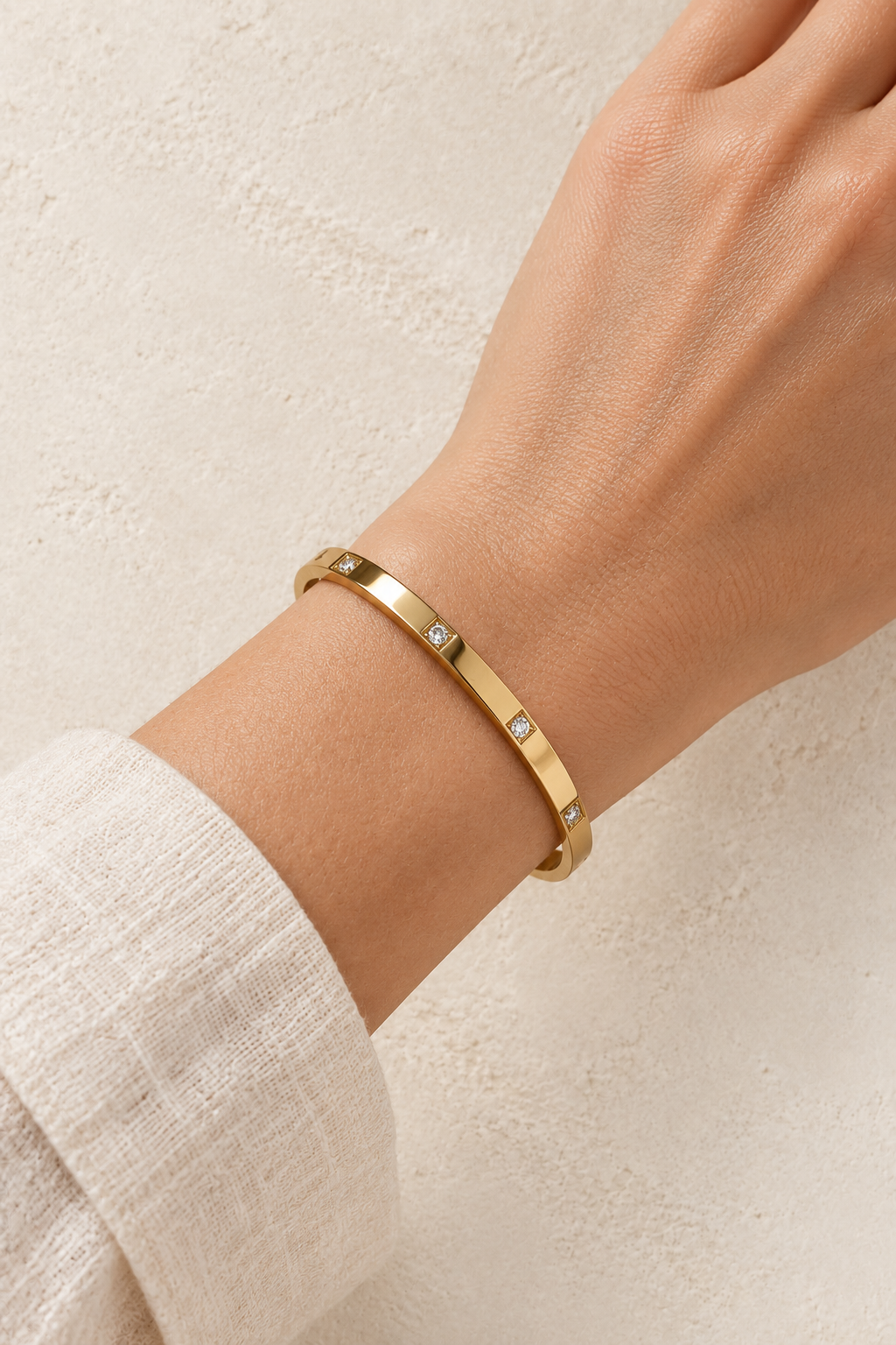 
                  
                    Model wearing Stola Gold Crystal Station Bangle
                  
                
