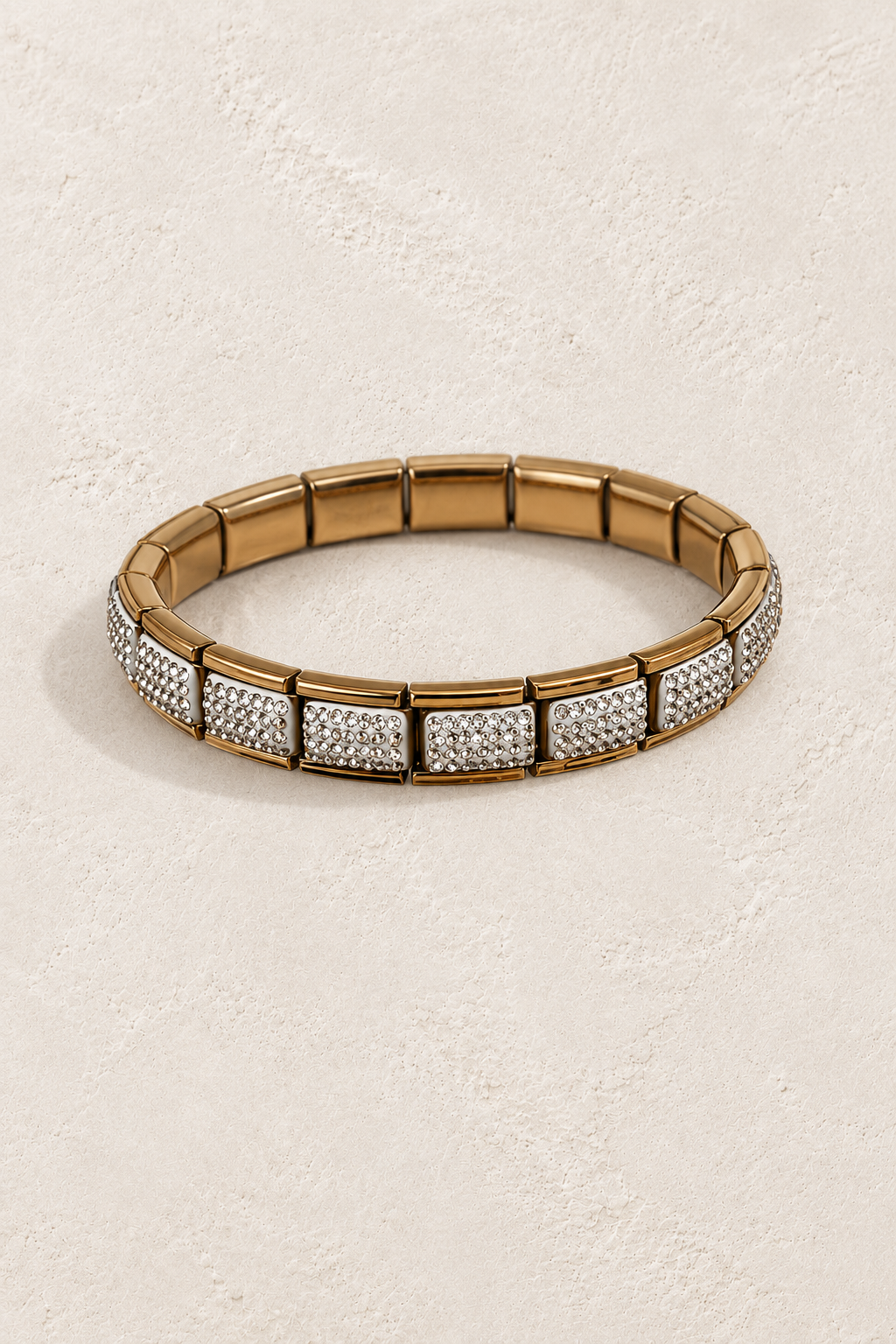 
                  
                    Talia Gold Pavé Tile Bangle on cream beige textured background
                  
                