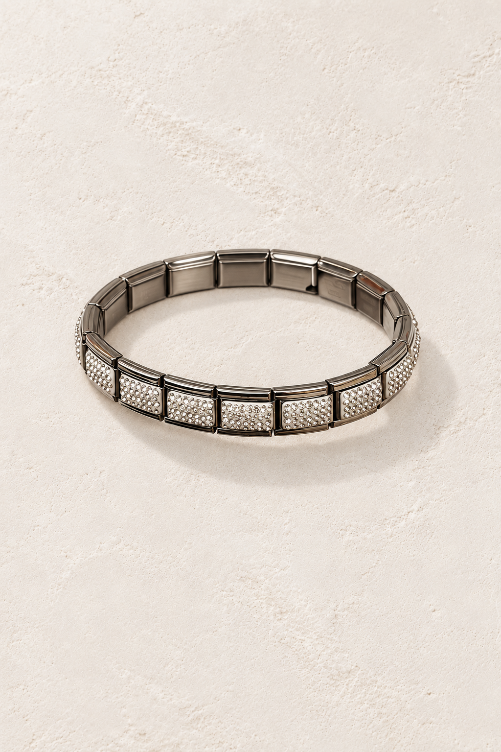 
                  
                    Talia Silver Pavé Tile Bangle on cream beige textured background
                  
                