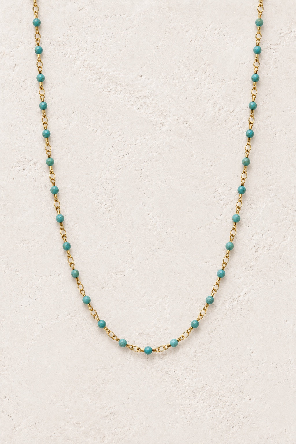 Tivara Turquoise gemstone beaded necklace on a light neutral background