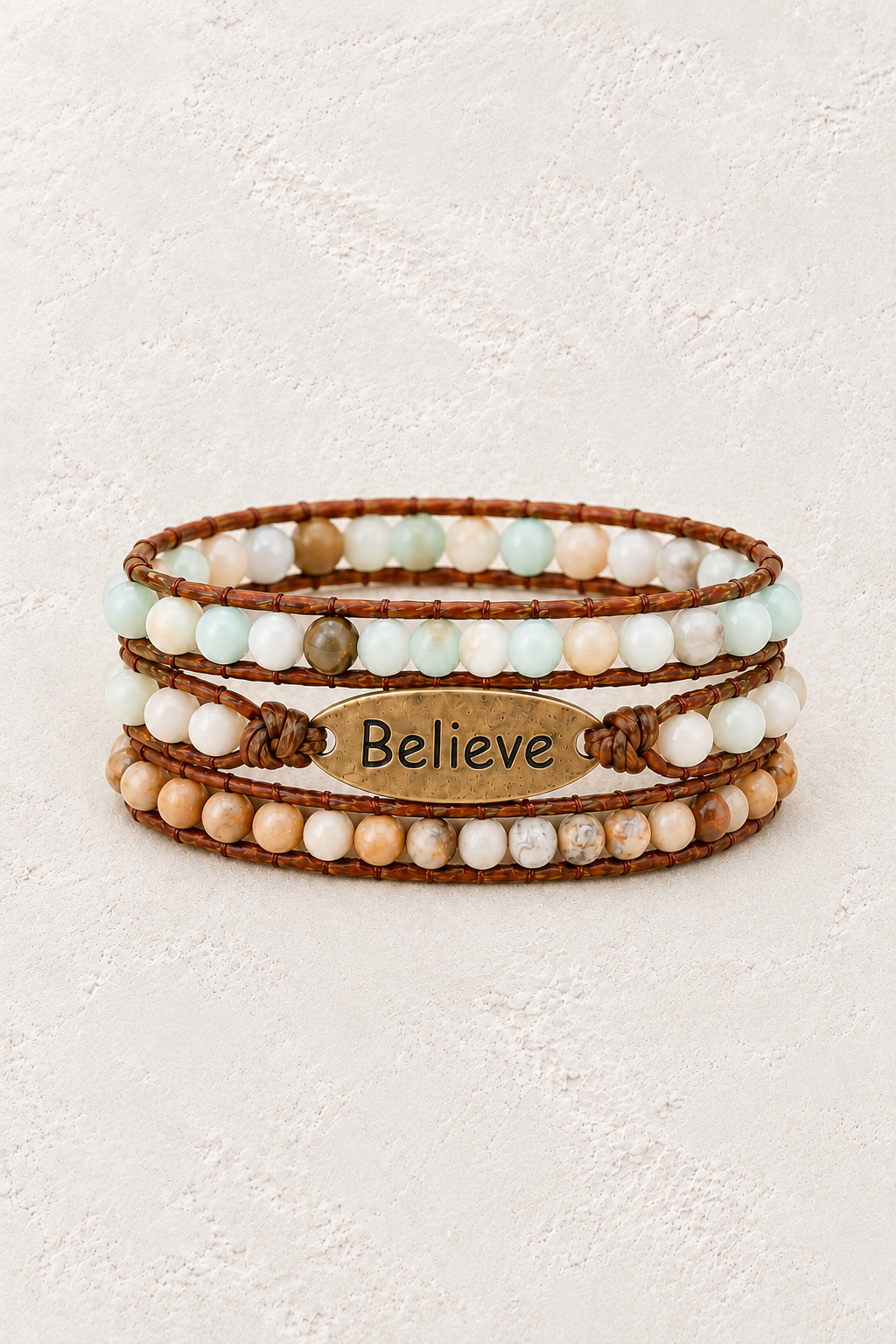 
                  
                    Believe Handmade Natural Stone Wrap Bracelet on the Boho & Mala warm-white textured background
                  
                