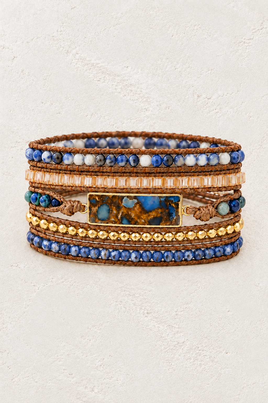 
                  
                    Handmade Sodalite Mixed Natural Stone Wrap Bracelet on the Boho & Mala warm-white textured background
                  
                