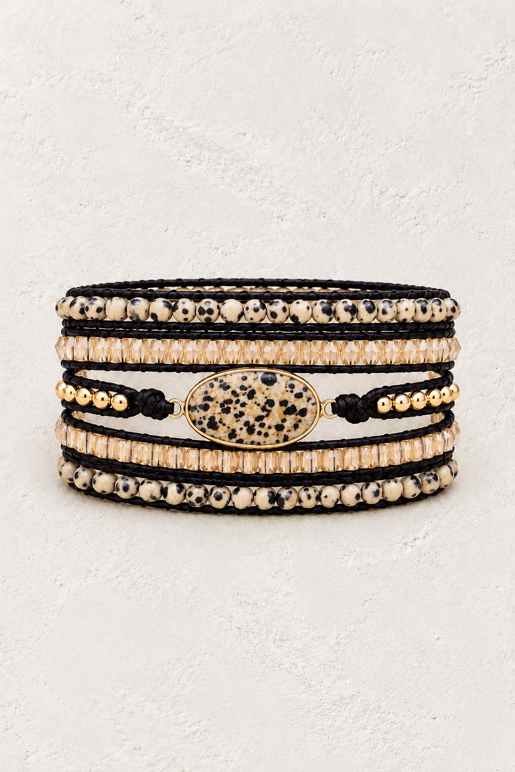 
                  
                    Handmade Dalmatian Jasper Mixed Natural Stone 5 Wrap Bracelet on the Boho & Mala warm-white textured background
                  
                