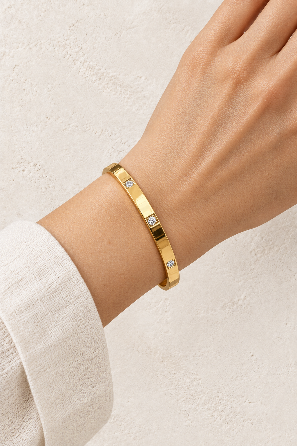 
                  
                    Model wearing Gold Square Crystal Bangle | Waterproof
                  
                