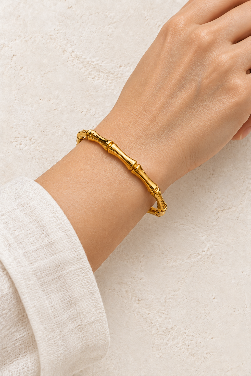 
                  
                    Model wearing Gold Bamboo Style Bangle | Waterproof
                  
                