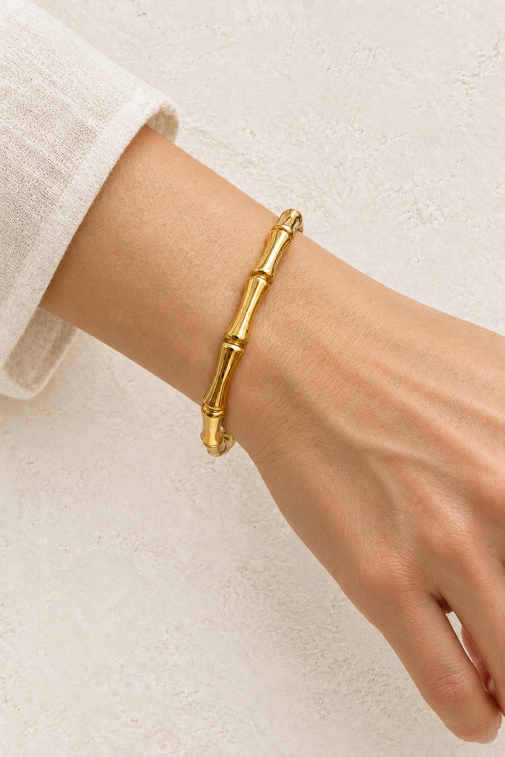 
                  
                    Model wearing Gold Slim Bamboo Style Bangle | Waterproof
                  
                