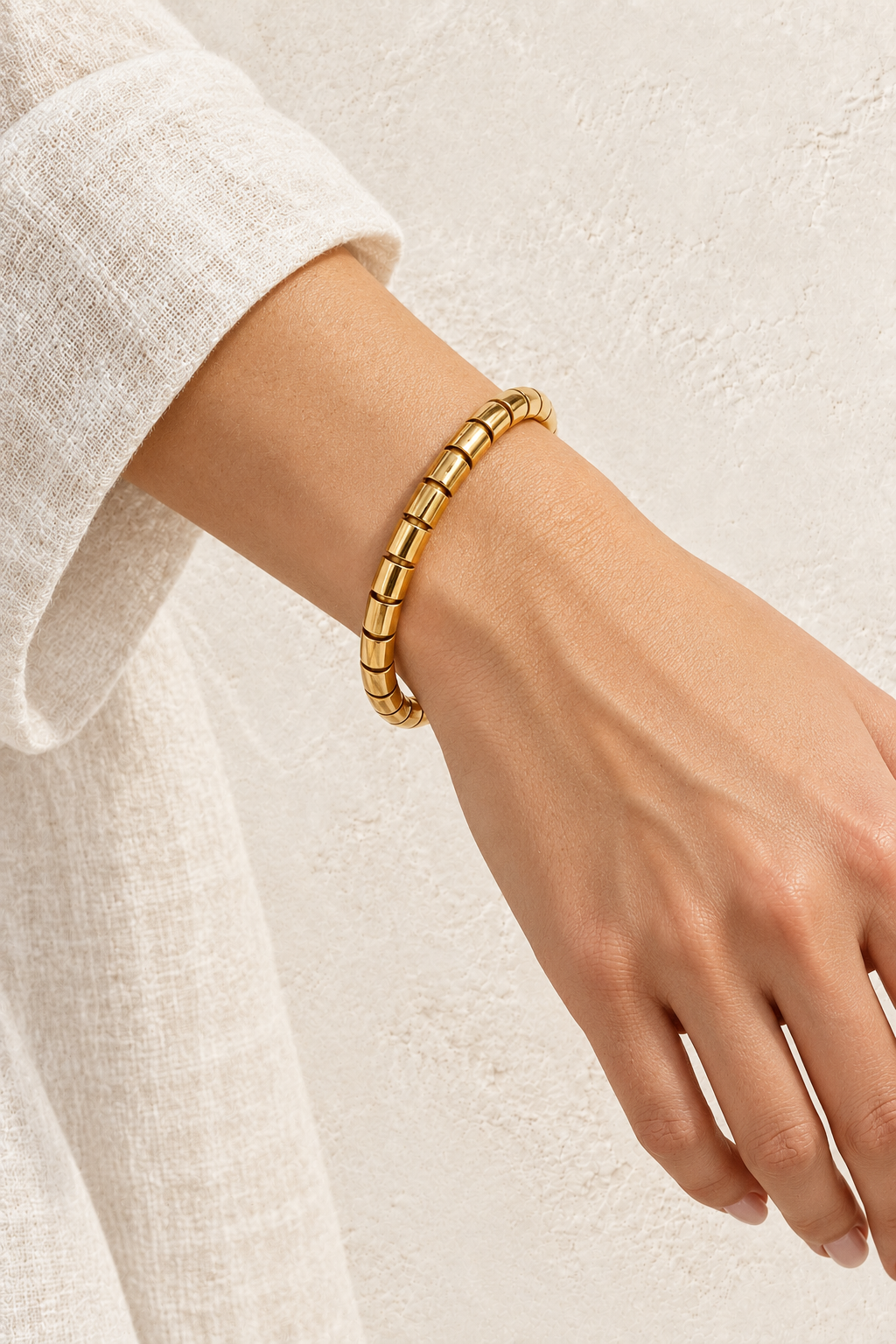 
                  
                    Model wearing Gold Tubular Segmented Bangle | Waterproof
                  
                