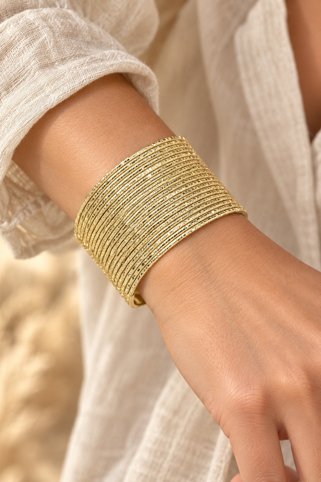 
                  
                    Zahara Multi-Strand Cuff worn on a model's wrist
                  
                