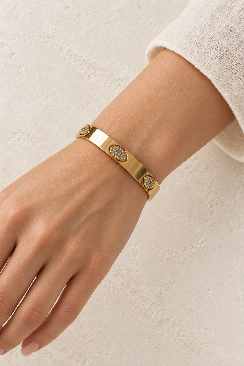 
                  
                    Model wearing Zaria Gold Evil Eye Bangle
                  
                